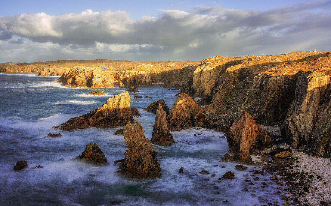 Mangersta Sea Stacks bathed in golden afternoon light, Isle of Lewis, Outer Hebrides, Scotland, United Kingdom, Europe