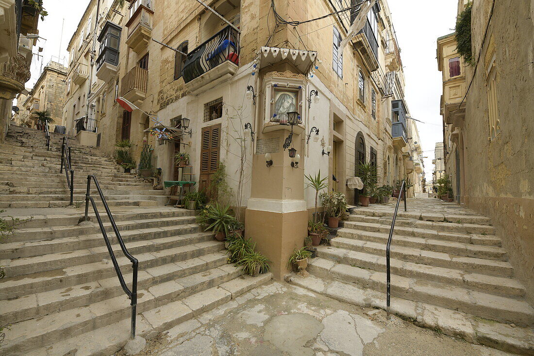 Corner with stairs and picture of the Virgin Mary on a street in Senglea, Malta, Mediterranean, Europe