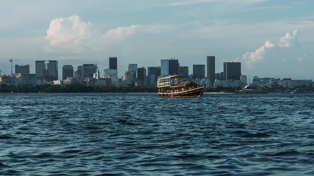 View of Downtown Rio with a leisure boat in the foreground, Rio de Janeiro, Brazil, South America