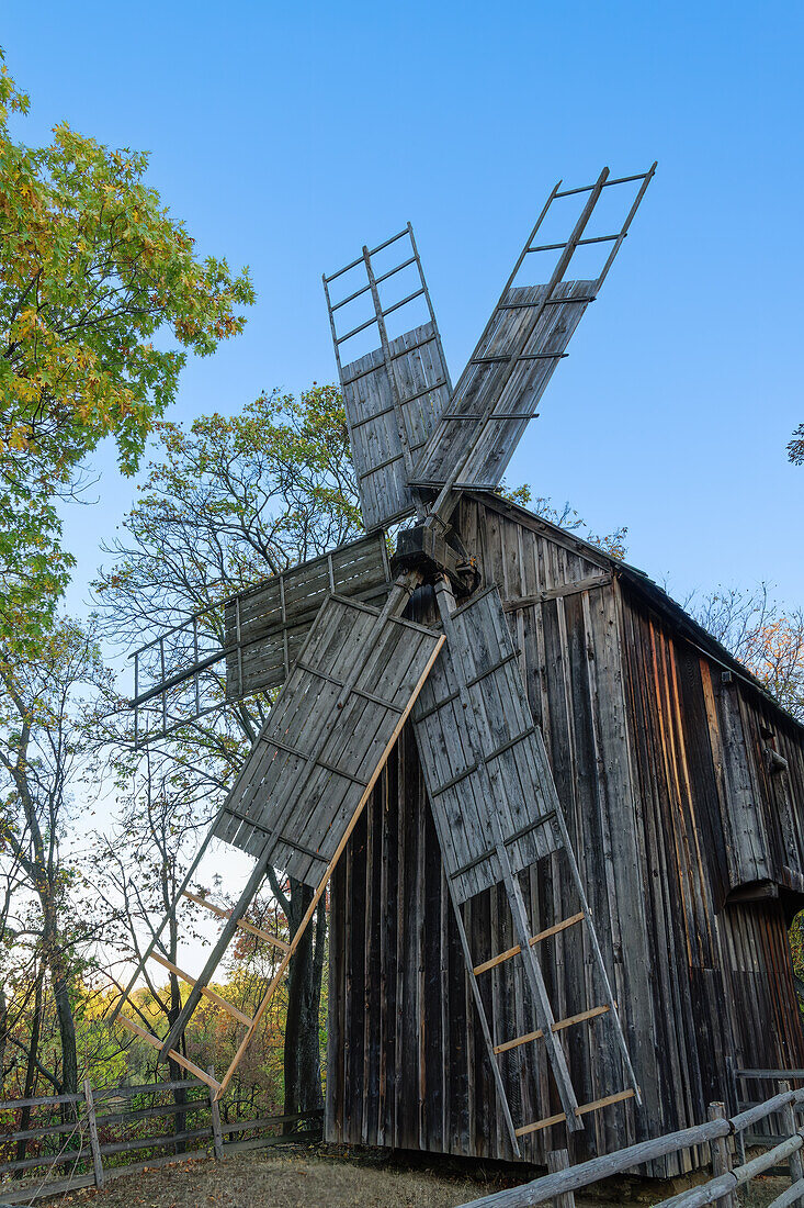 Historic windmill exhibited as part of a traditional Romanian village life inside Dimitrie Gusti National Village Museum, Bucharest, Romania, Europe