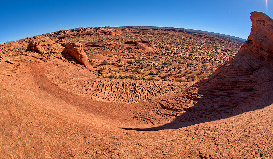 A wavy sandstone slope, a fossilized sand dune, at Ferry Swale in the Glen Canyon Recreation Area near Page, Arizona, United States of America, North America