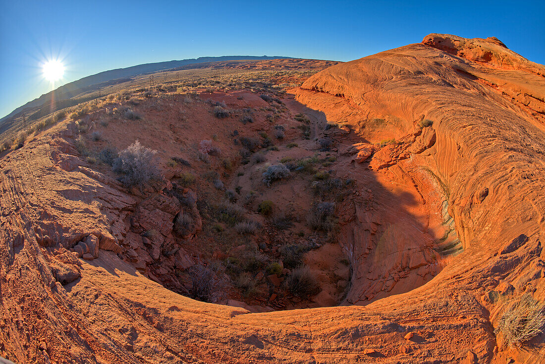 A dry waterfall at the base of a rock island at Ferry Swale in the Glen Canyon Recreation Area near Page, Arizona, United States of America, North America