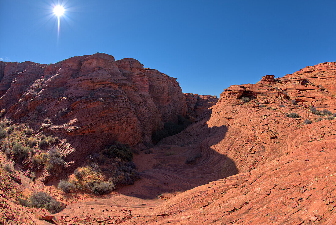 A dry waterfall of wavy sandstone in the spur canyon just north of the main overlook of Horseshoe Bend, Arizona, United States of America, North America