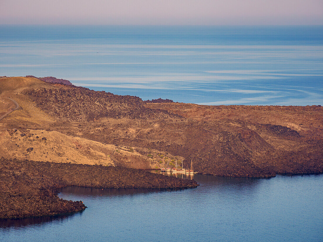 Nea Kameni Volcano at the caldera seen from Fira, sunrise, Santorini (Thira) Island, Cyclades, Greek Islands, Greece, Europe