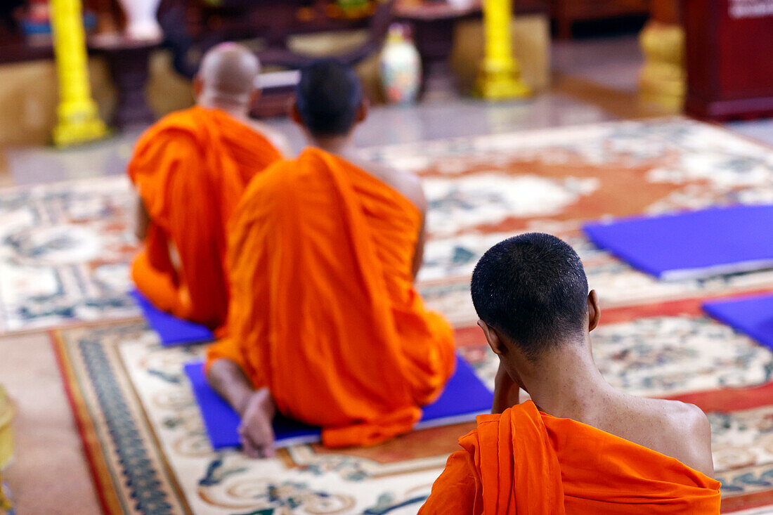 Buddhist monks praying to the Buddha, Munirensay Buddhist Temple, Can Tho, Vietnam, Indochina, Southeast Asia, Asia