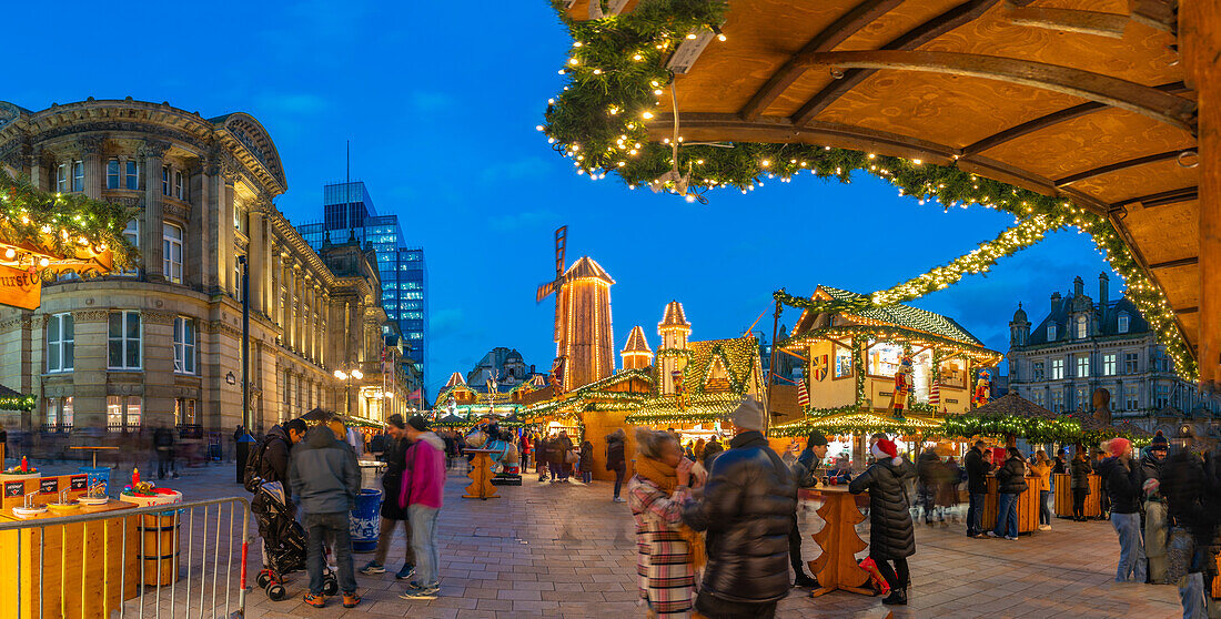 View of Christmas Market stalls in Victoria Square at dusk, Birmingham, West Midlands, England, United Kingdom, Europe