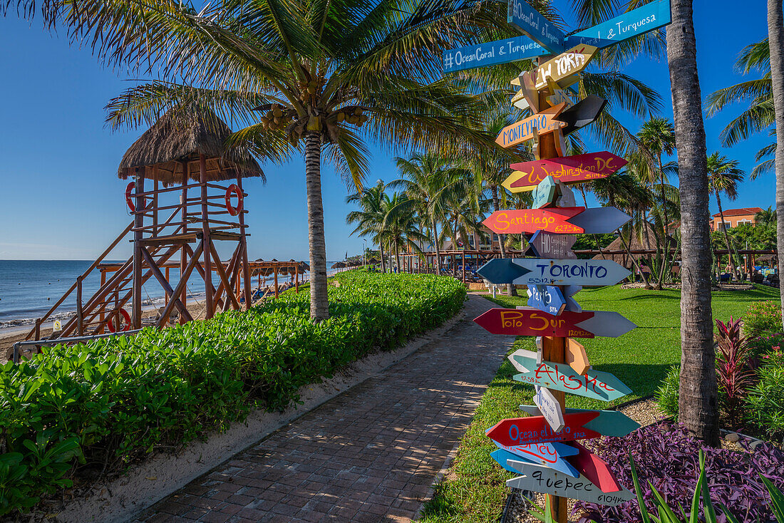 View of colourful hotel destination signpost near Puerto Morelos, Caribbean Coast, Yucatan Peninsula, Mexico, North America