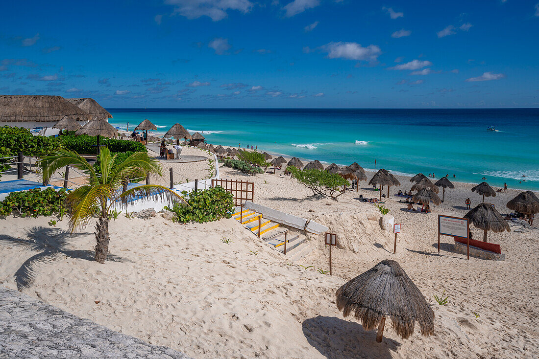 View of long white sandy beach at Playa Delfines, Hotel Zone, Cancun, Caribbean Coast, Yucatan Peninsula, Mexico, North America