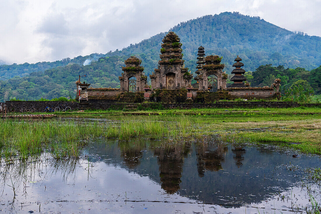 Reflection of the temple Ulun Danu Tamblingan in the water of the lake, Munduk, Bali, Indonesia, Southeast Asia, Asia