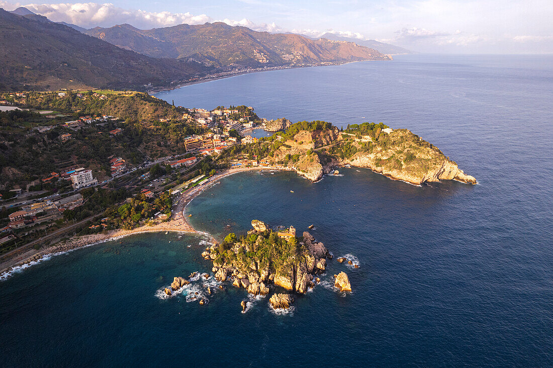 Aerial view of the Sicilian rocky shoreline of Taormina municipality with Isola Bella in the foreground, Taormina, Ionian sea, Mediterranean sea, Messina province, Sicily, Italy, Mediterranean, Europe