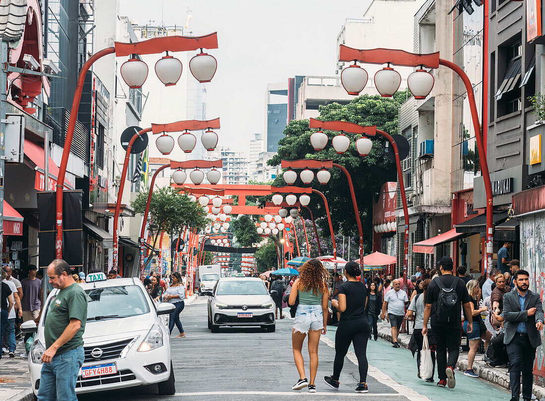 View of the main street in Liberdade neighbourhood, home to a large part of Brazil's Japanese community, Sao Paulo, Brazil, South America