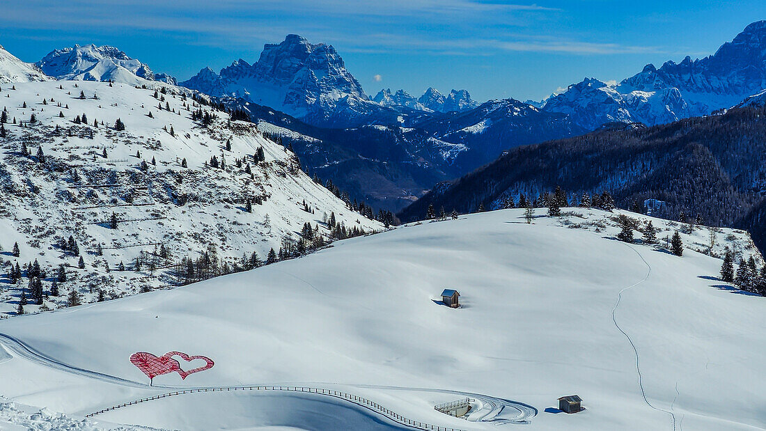 Snowy winter landscape, with pink heartsand mountains, UNESCO World Heritage Site, Dolomites, Italy, Europe