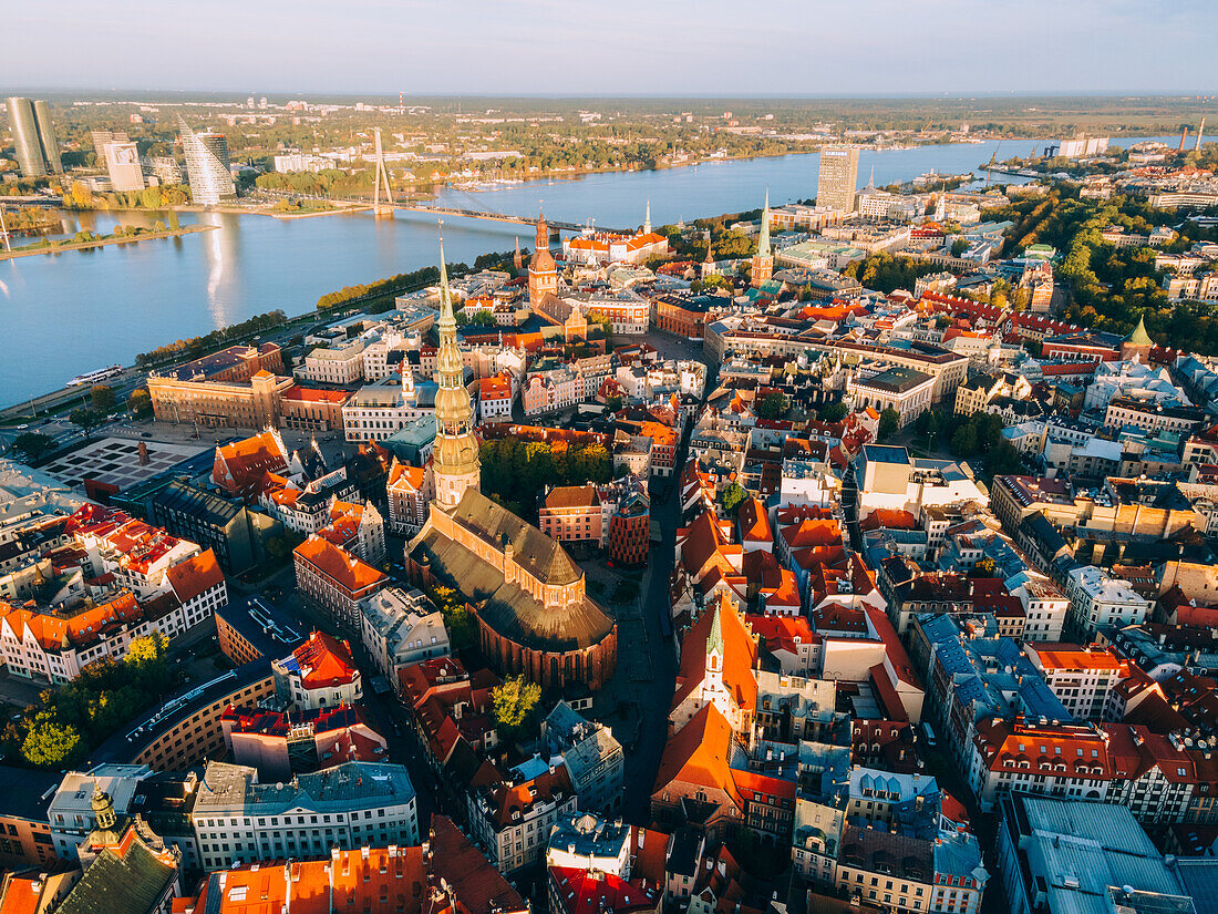 Aerial drone sunrise view of St. Peter's Church in Riga Old Town (Vecriga), UNESCO World Heritage Site, Riga, Latvia, Europe