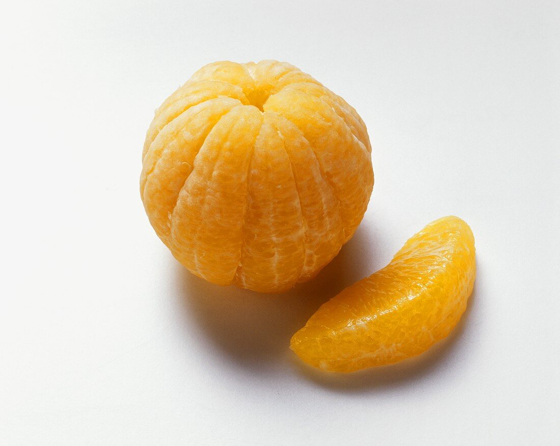 Peeled mandarin and a segment  