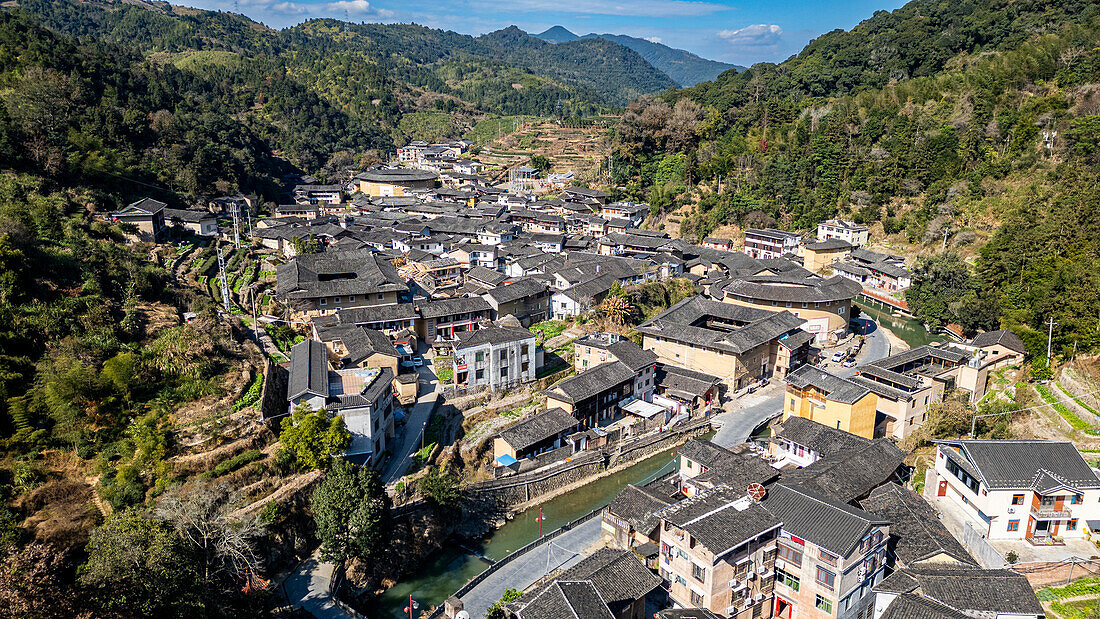 Aerial of Taxia village and Fujian Tulou, rural dwelling of the Hakka, Fujian, China, Asia