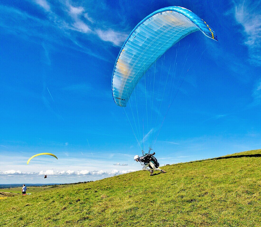 Paraglider taking off at Mount Caburn, near Lewes, East Sussex, England, United Kingdom, Europe