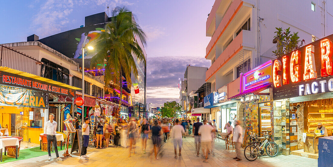 View of busy 5th Avenue at dusk, Playa del Carmen, Quintana Roo, Caribbean Coast, Yucatan Peninsula, Riviera Maya, Mexico, North America