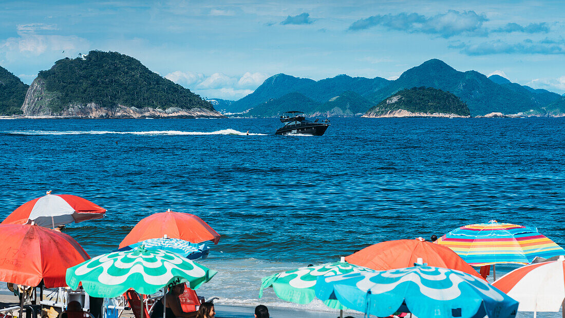 A man on a jet-ski overlooking Copacabana Beach, Rio de Janeiro, Brazil, South America