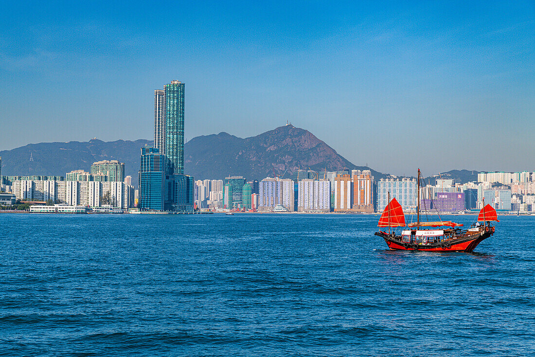 Traditional sailing boat in front of high rise buildings in Central Hongkong, China, Asia