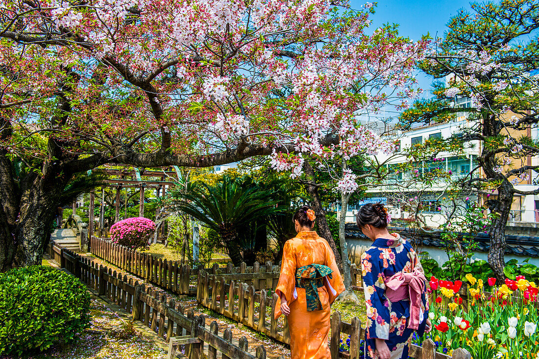 Traditionally dressed women in Dejima, a man made island in the port of Nagasaki, Kyushu, Japan, Asia