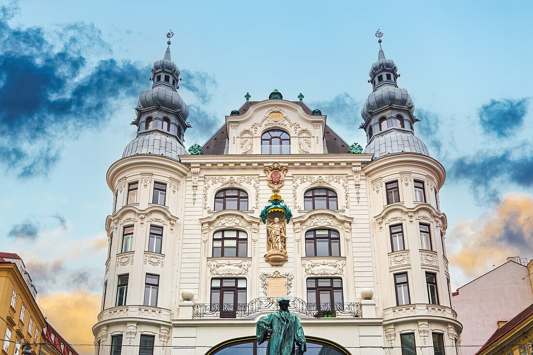 1897 Regensburger Hof building at Lugeck square with a statue of Johannes Gutenberg, Vienna, Austria, Europe