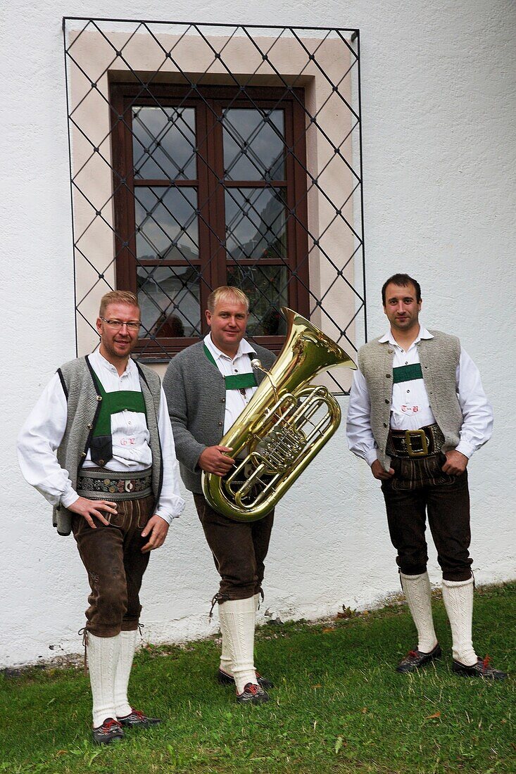 Italy, autonomous province of Bolzano, San Candido, three musicians in traditional Tyrolean costume