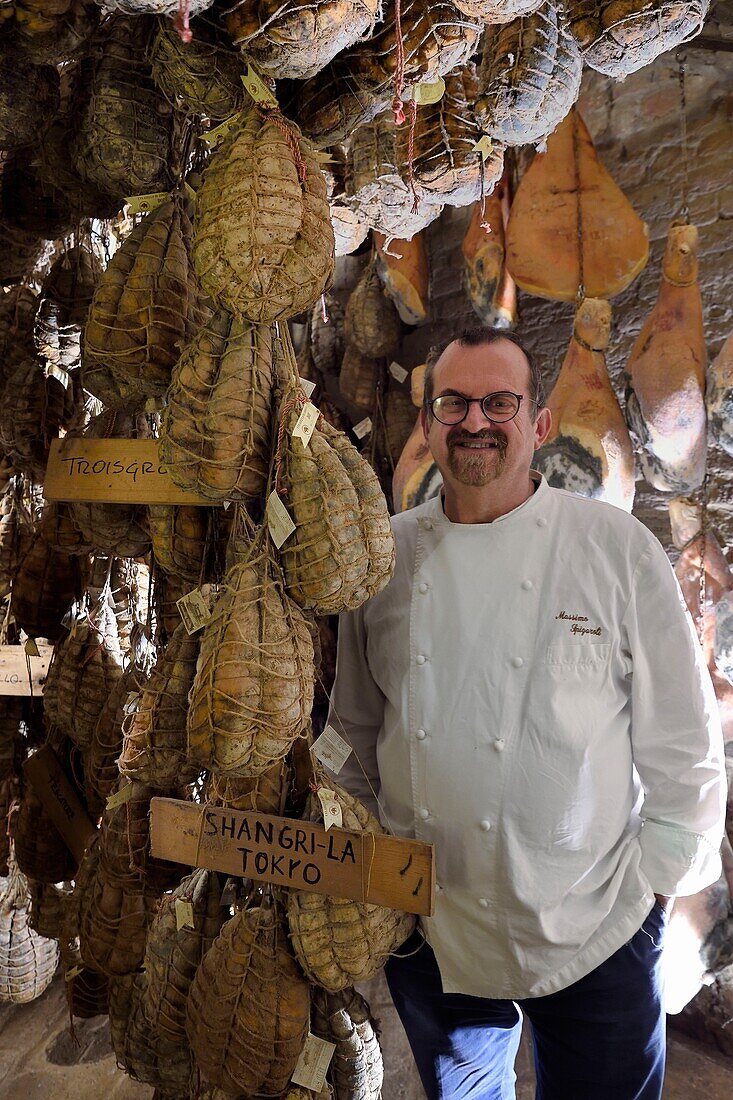 Italy, Emilia Romagna, Polesine Zibello near Parma, Antica Corte Pallavicina, the chef Massimo Spigaroli in his culatello maturing cellar, traditional ham of Parma