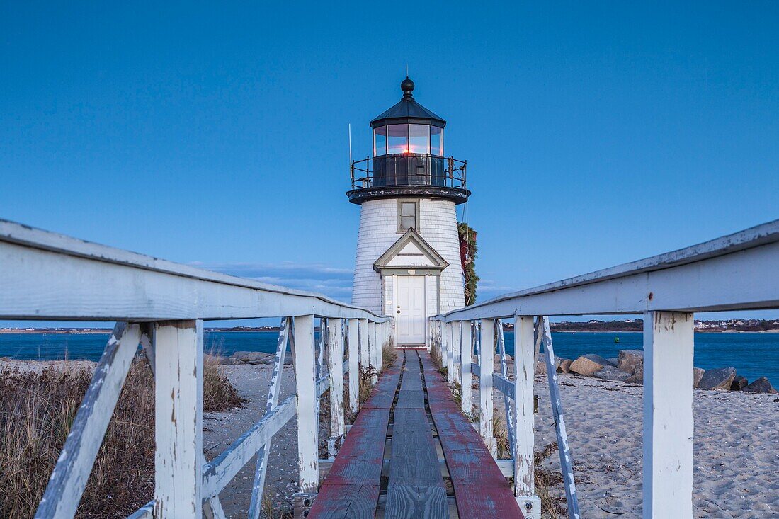 United States, New England, Massachusetts, Nantucket Island, Nantucket, Brant Point Lighthouse with a Christmas wreath, dusk