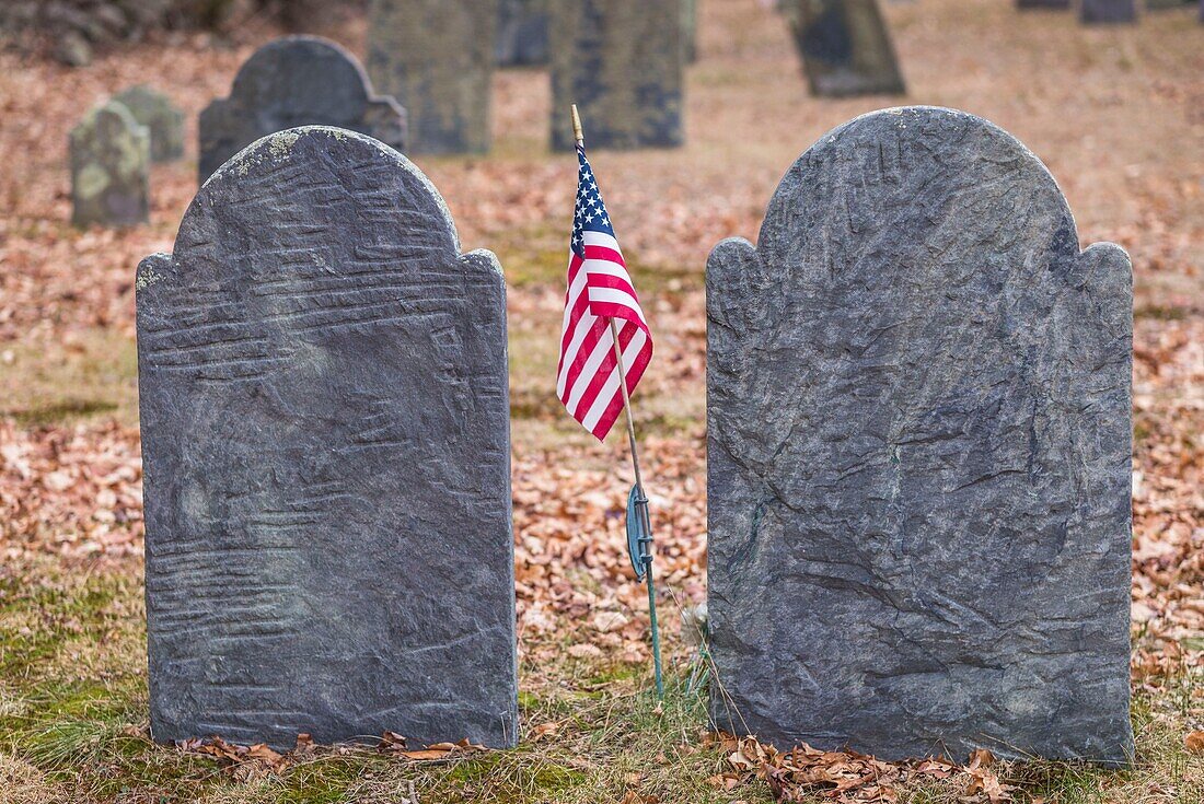 United States, New England, Massachusetts, Rowley, historic cemetery gravestones with US flag