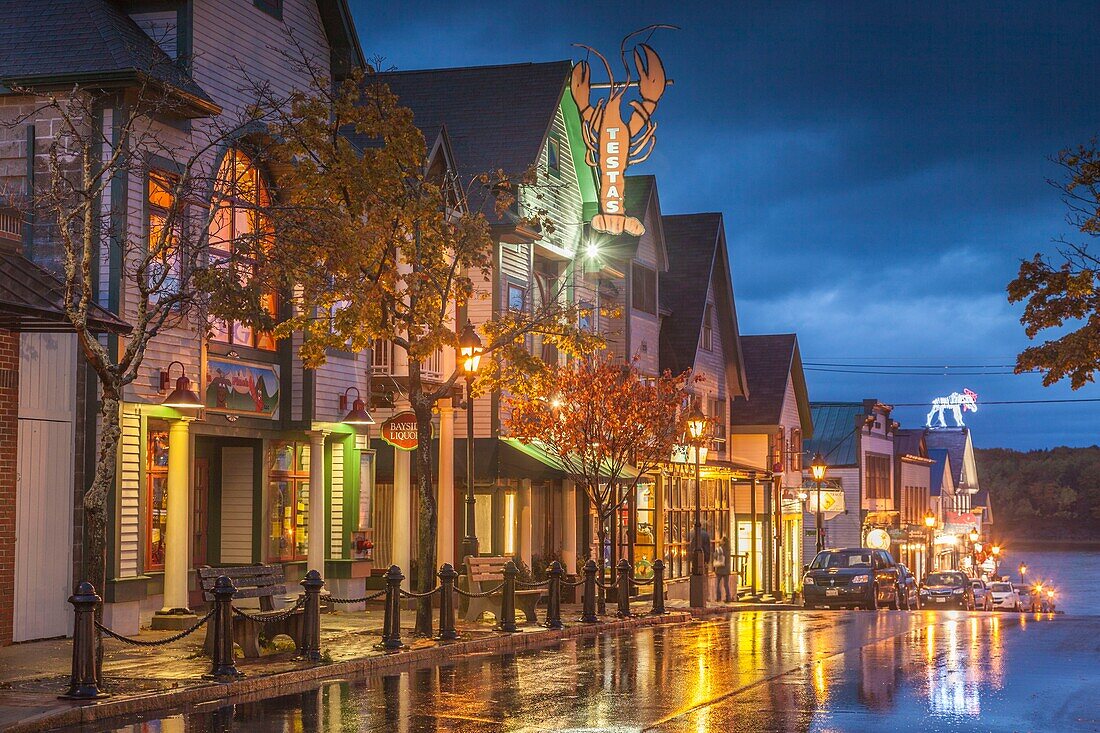 United States, Maine, Mt. Desert Island, Bar Harbor, restaurants along Main Street, autumn, dusk