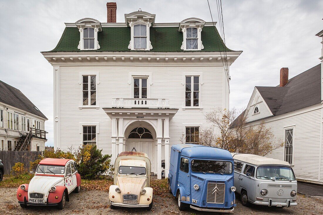 United States, Maine, Deer Isle, antique French cars with antique VW van