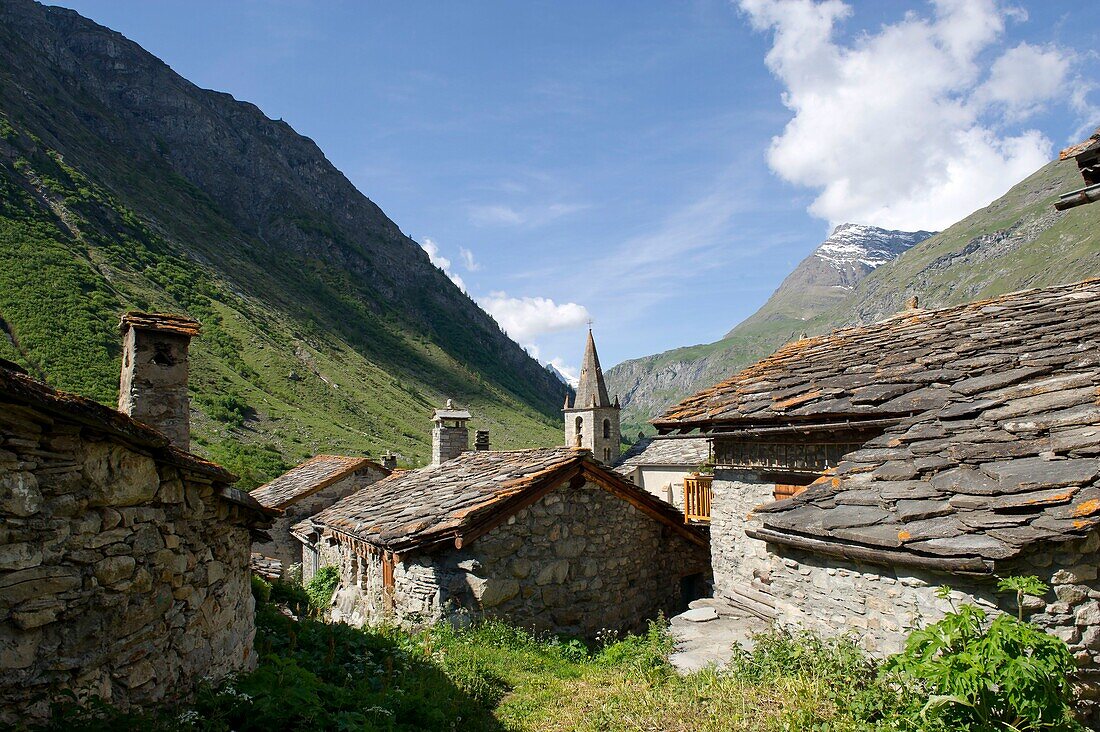 France, Savoie, Haute Maurienne, Vanoise massif, Bonneval sur Arc traditional stone houses covered with slate and bell tower of the church