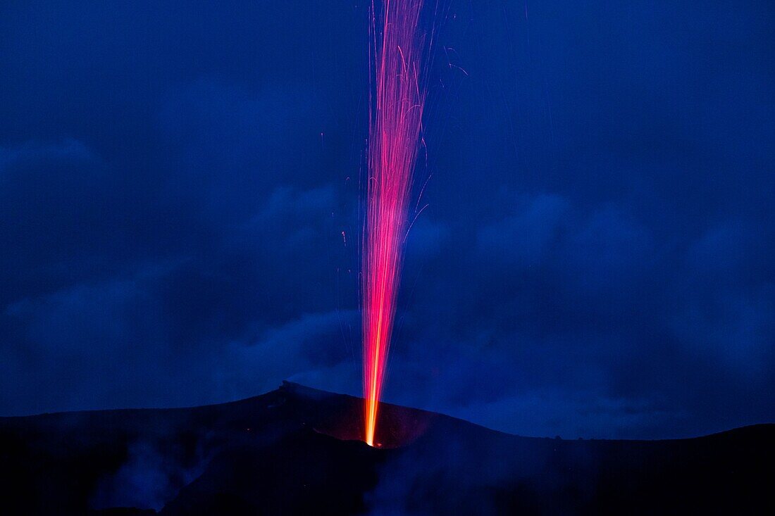 Italy, Sicily, Eolian Islands, Tyrrhenian sea, San Vincenzo, summit of Stromboli volcano 924 m, eruption of lava and projection of volcanic bombs from the central craters