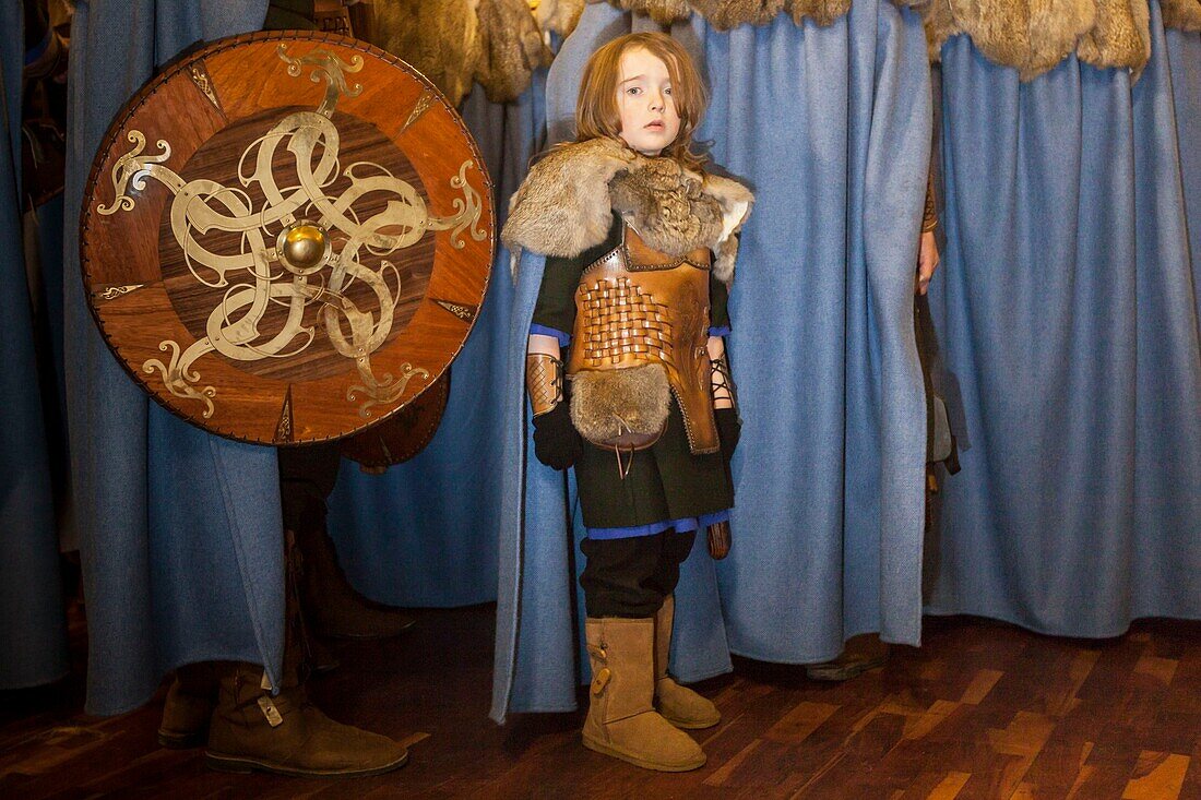 United Kingdom, Scotland, Shetland Islands, Mainland, Lerwick, Up Helly Aa festival, Guizer kid in a village hall after the ritual burning of the viking longship