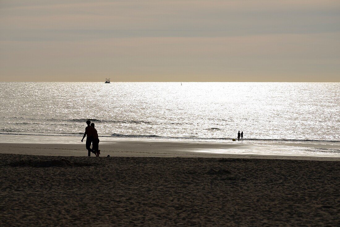 Belgium, West Flanders, Ostend, beach at the sunset