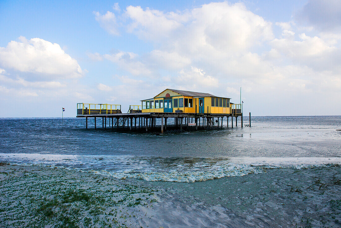 A Wooden, Elevated Beach House on North Beach / Noorderstrand on Schiermonnikoog Island, is used as Home Base of Kiters, Surfers and various other Watersports Enthousiasts. Wadden Sea, Groningen, Netherlands.