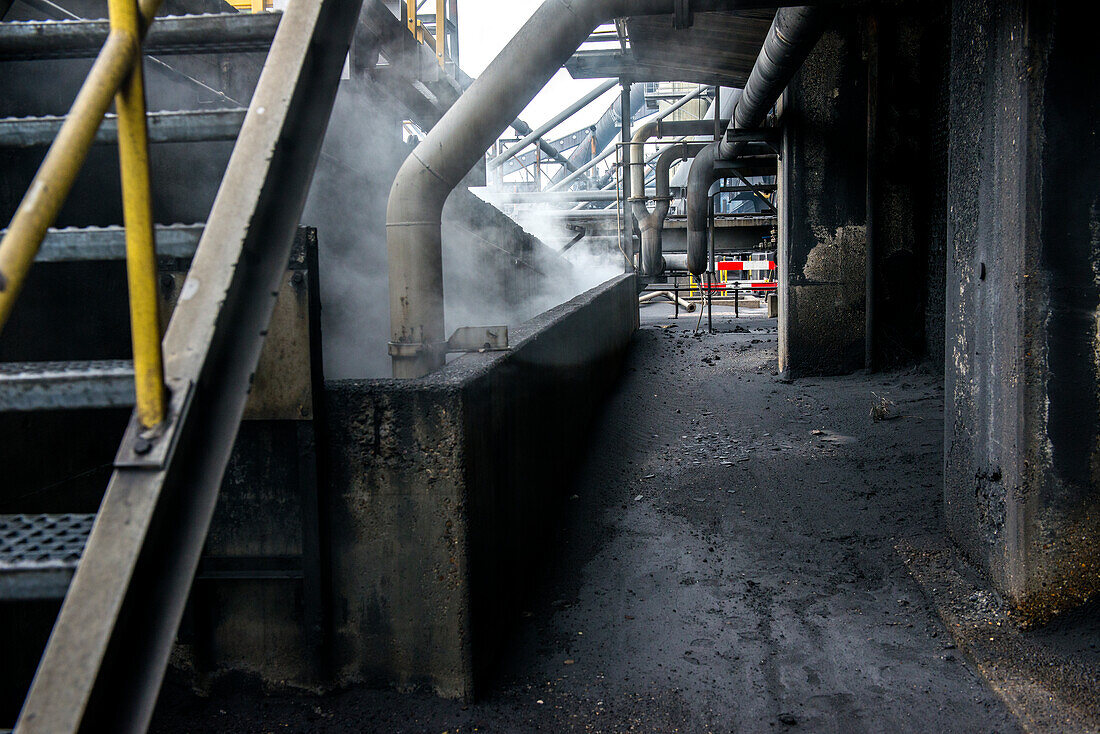 Huge, heavy steel production plant and industry terrain, producing various kinds of steel inside an CO2 Emitting and Exhausting Factory. IJmuiden, Netherlands.