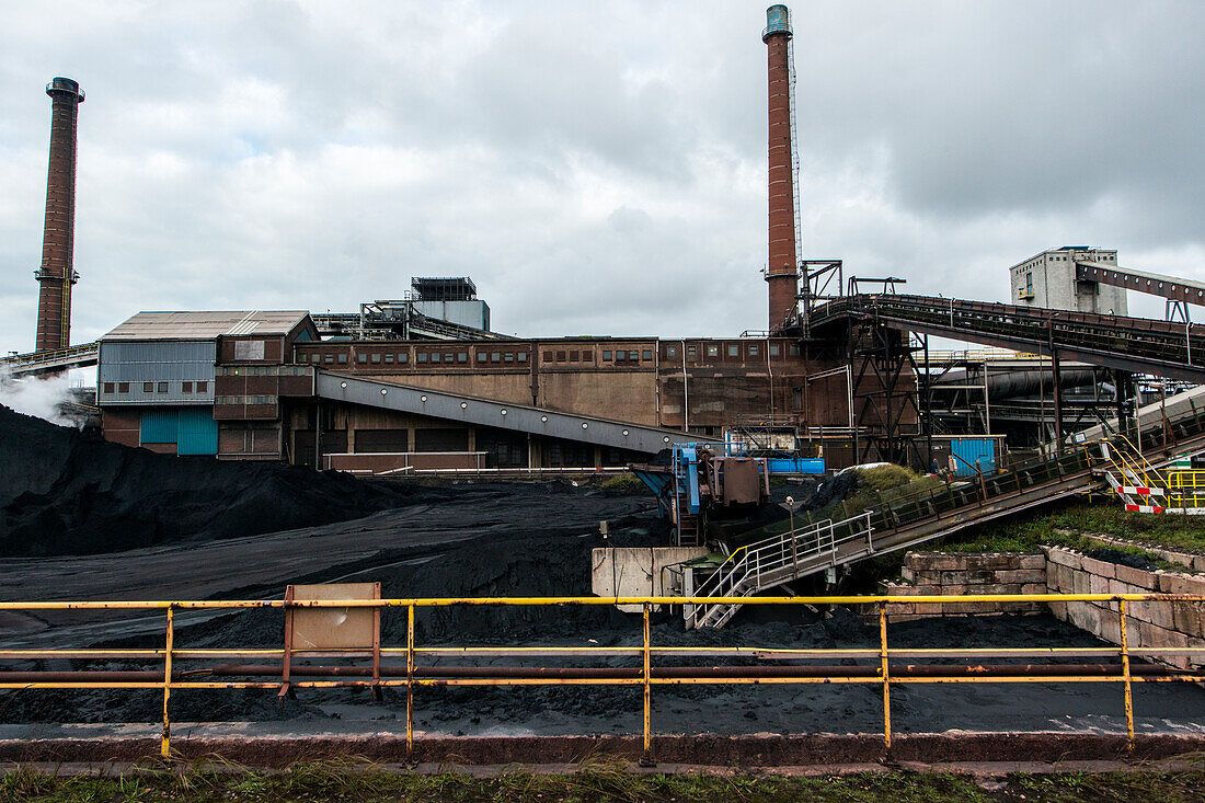 Huge, heavy steel production plant and industry terrain, producing various kinds of steel inside an CO2 Emitting and Exhausting Factory. IJmuiden, Netherlands.