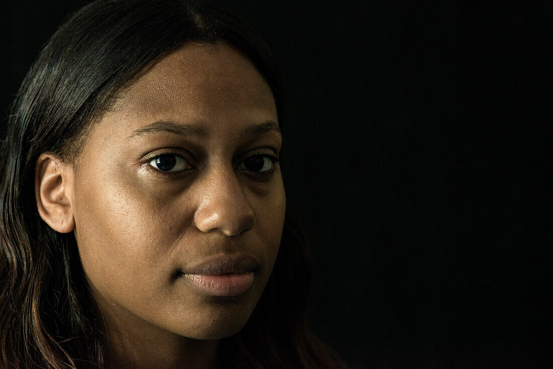 Studio Portrait of a Young Adult, Colored Woman born in the Caribbean. Tilburg, Netherlands.