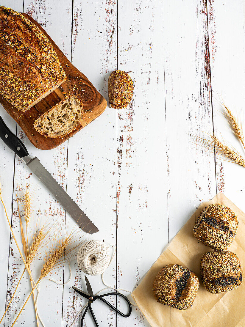 Fresh bread selection on a whitewashed wooden table