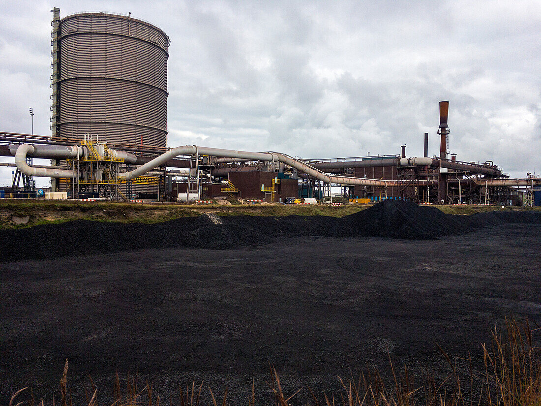 Huge, heavy steel production plant and industry terrain, producing various kinds of steel inside an CO2 Emitting and Exhausting Factory. IJmuiden, Netherlands.