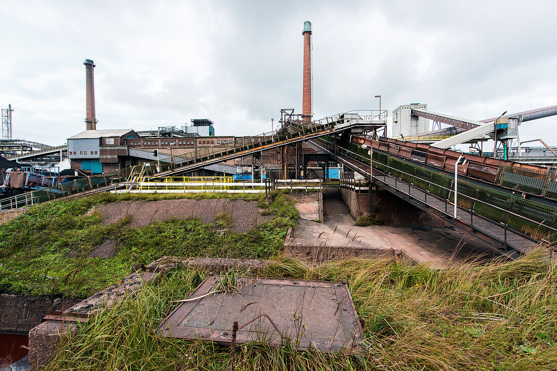 Huge, heavy steel production plant and industry terrain, producing various kinds of steel inside an CO2 Emitting and Exhausting Factory. IJmuiden, Netherlands.