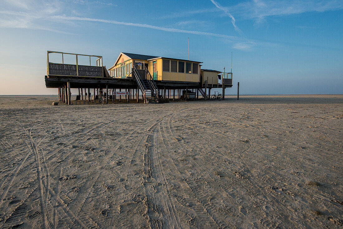 A Wooden, Elevated Beach House on North Beach / Noorderstrand on Schiermonnikoog Island, is used as Home Base of Kiters, Surfers and various other Watersports Enthousiasts. Wadden Sea, Groningen, Netherlands.