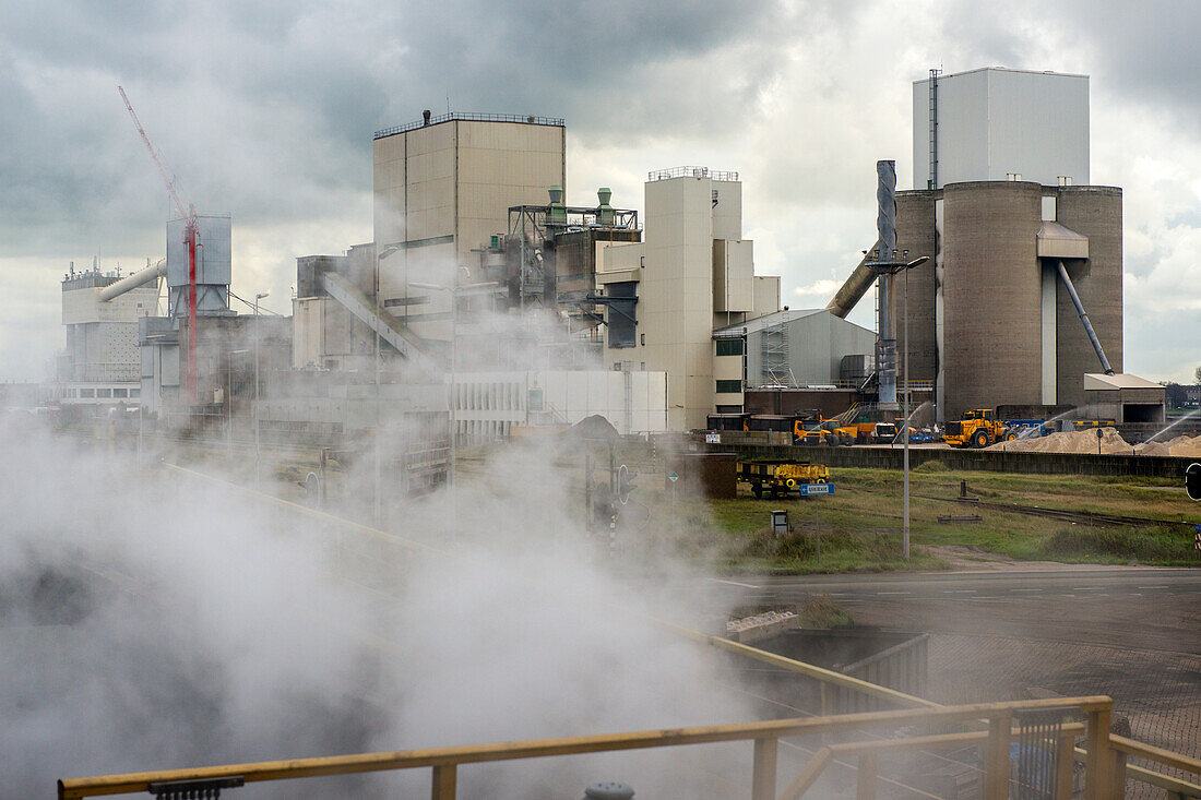 Huge, heavy steel production plant and industry terrain, producing various kinds of steel inside an CO2 Emitting and Exhausting Factory. IJmuiden, Netherlands.