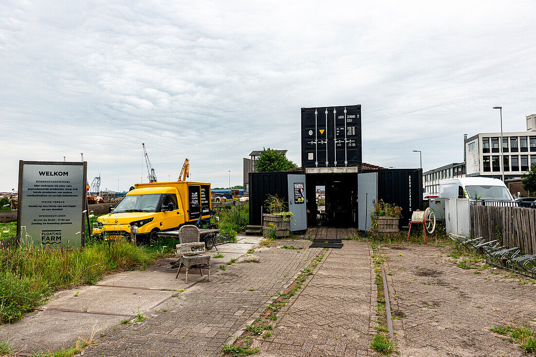 The Floating Farm Diary Shop sellf Diary Products to Customers, which are Produced right outside within an Industrial Harbour Zone. Rotterdam, Netherlands.