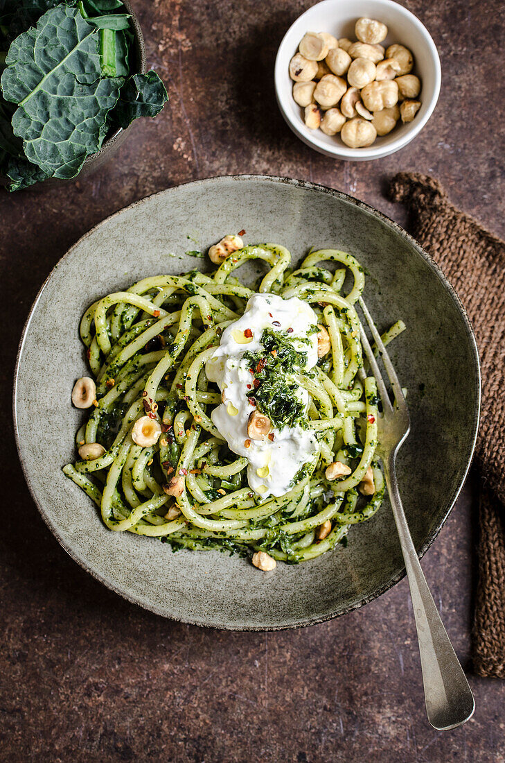 Pasta with kale and hazelnut pesto served with burrata