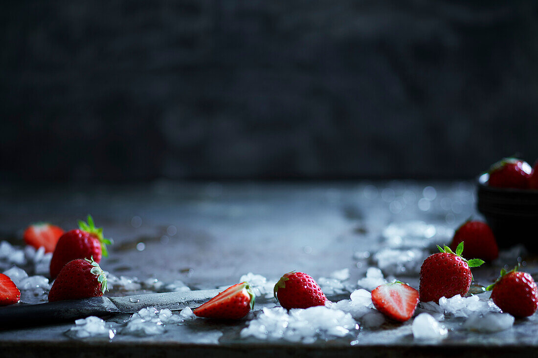 Fresh strawberries on a grey metal background