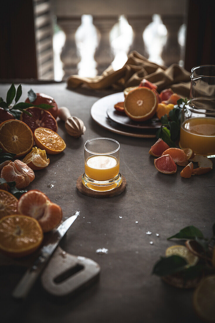 Immune juice. Oranges, lemons, grapefruit and tangerines with mint on wooden rustic background closeup