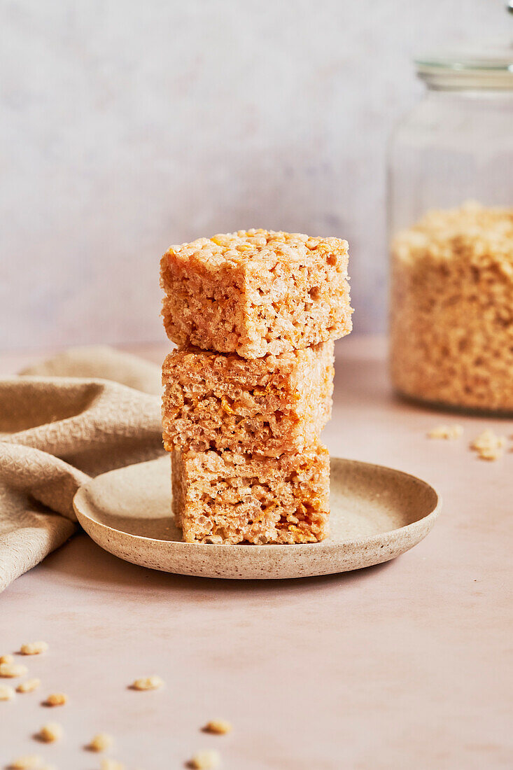 Rice Crispie Treats on a plate with napkin