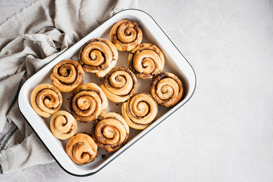 Cinnamon Buns baked in a dish on a bright background